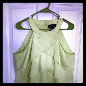 Green button in the back tank top.